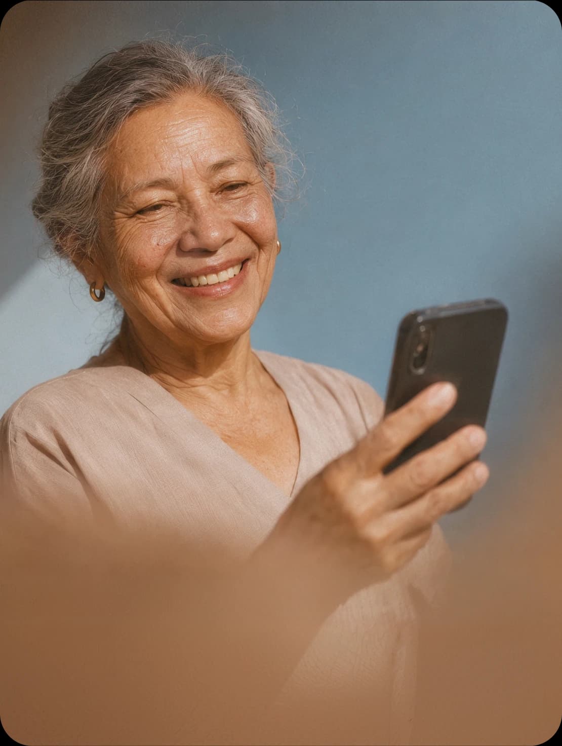 An older woman talking on the phone