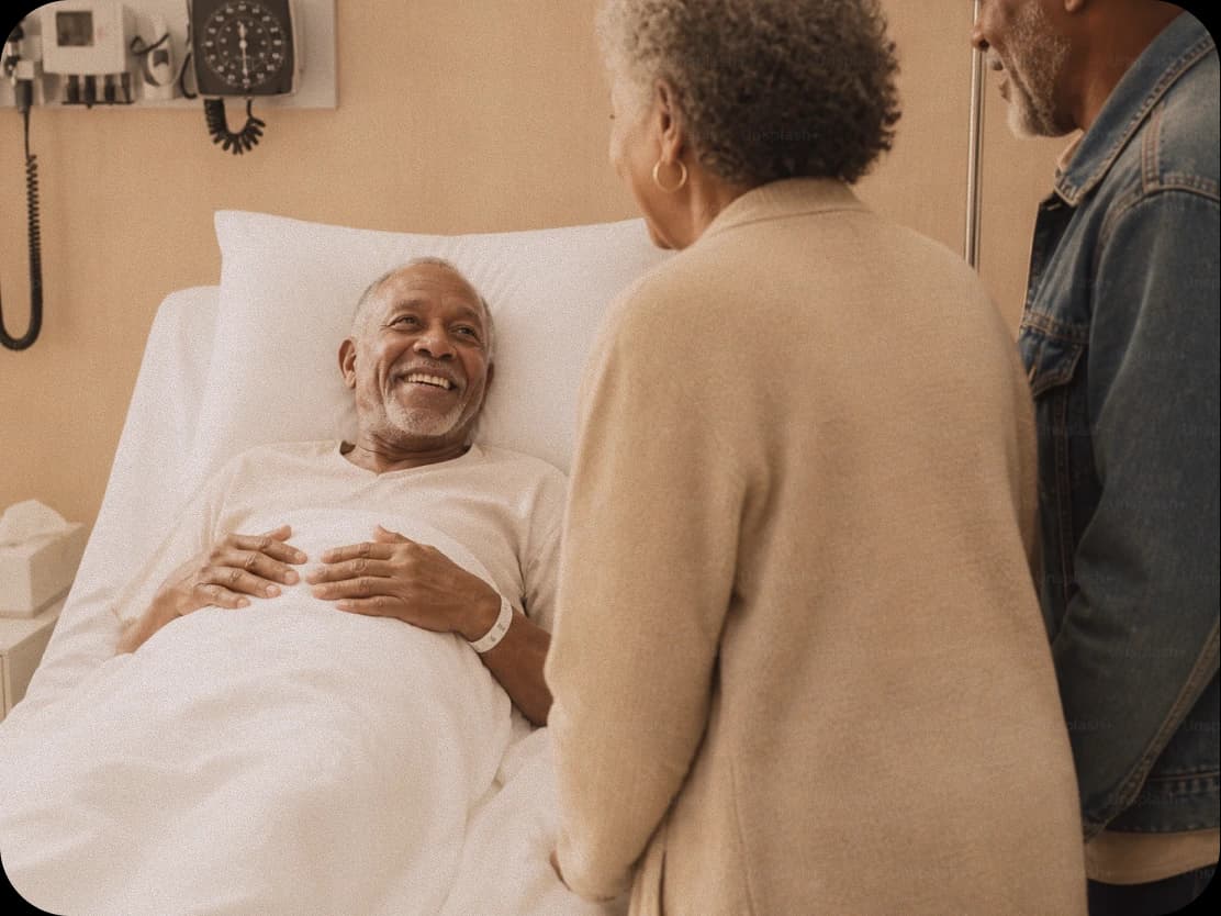A patient at home with a visiting family member and a care worker