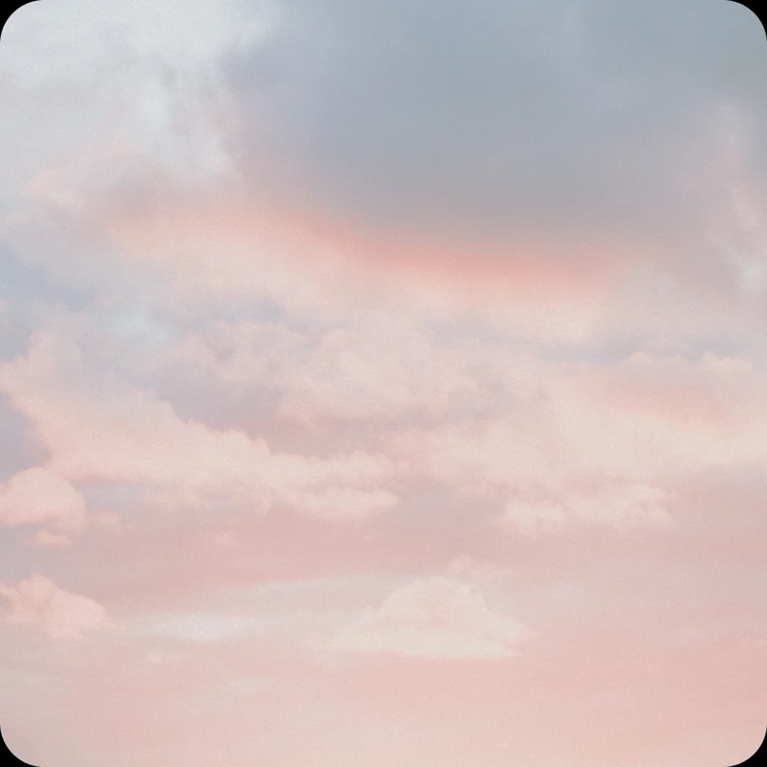 Soft pink clouds at altitude