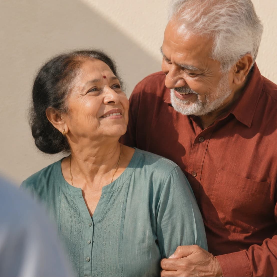 An older couple sitting together at home